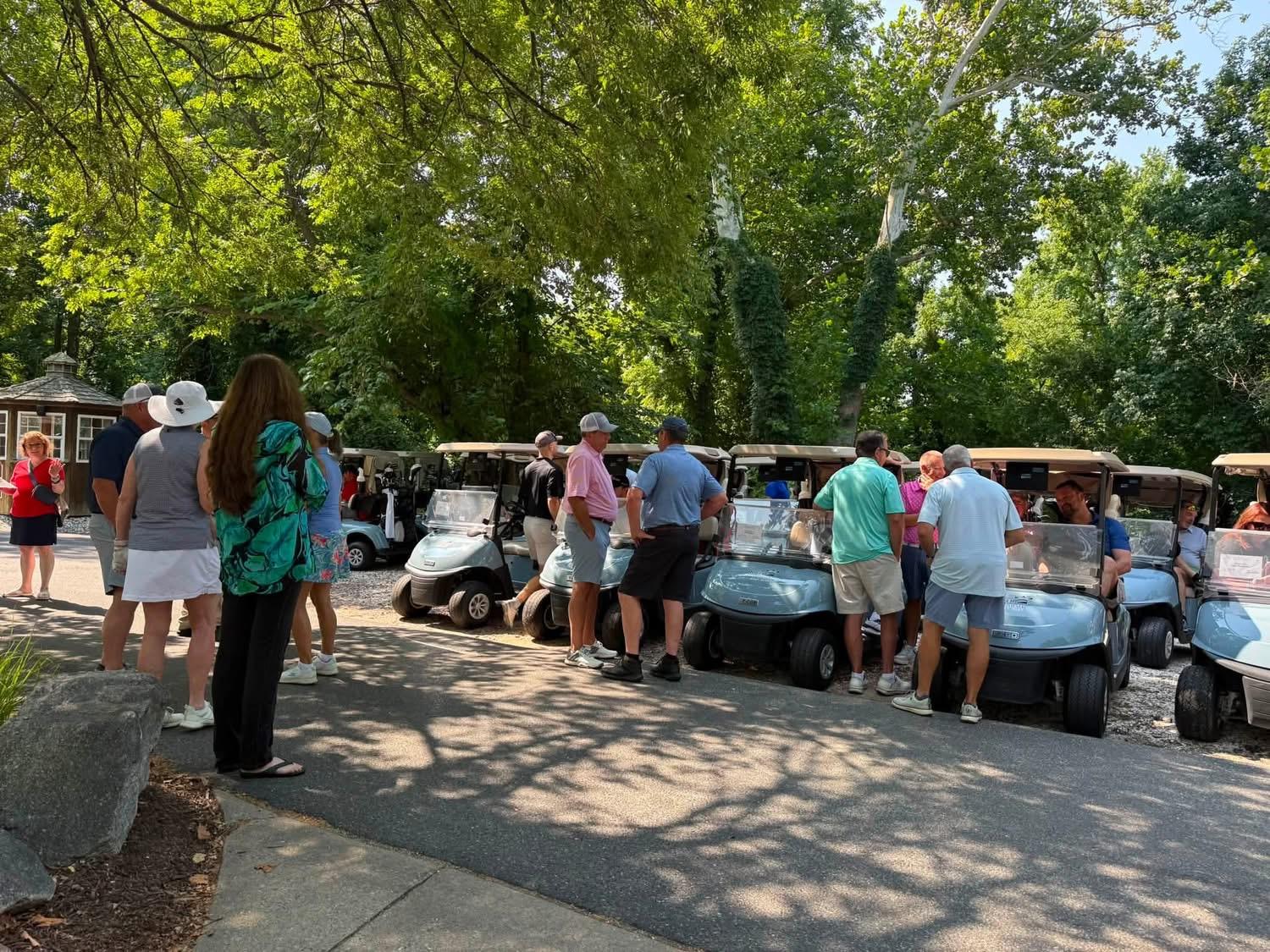 Participants get in their carts at the beginning of the 2026 VMDAEC Annual Meeting Golf Tournament